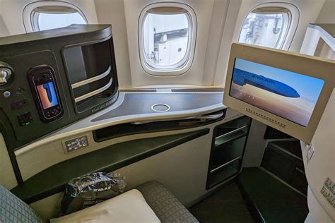 EVA Air business class lie-flat bed with bedding on Boeing 777-300ER