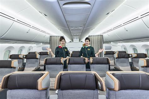 EVA Air cabin crew in new Premium Economy uniforms at DFW debut event