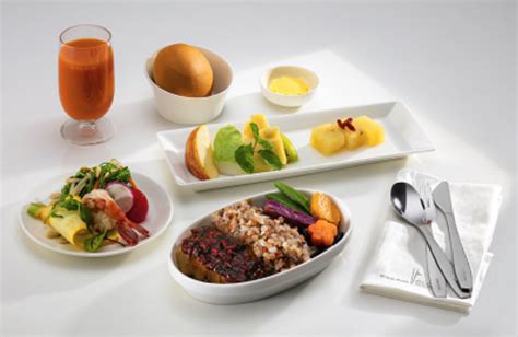 EVA Air premium economy meal service with luxury tableware