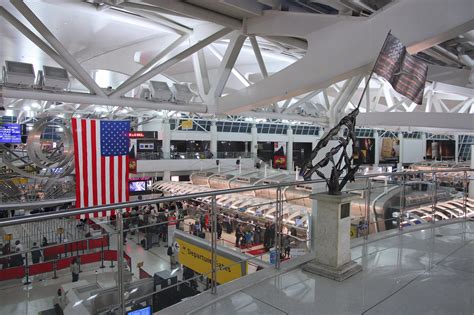 exhausted passengers at JFK Terminal 4