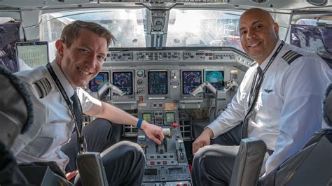 experienced airline captain inside widebody jet cockpit during international flight operations