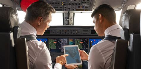 experienced corporate pilot briefing trainees before simulator session