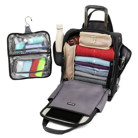 experienced traveler with compact backpack and roller bag at American Airlines gate