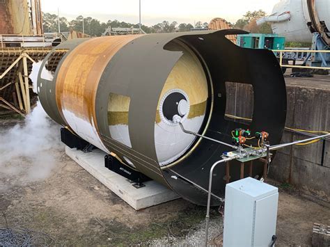 experimental composite fuel tank undergoing stress testing in aerospace lab