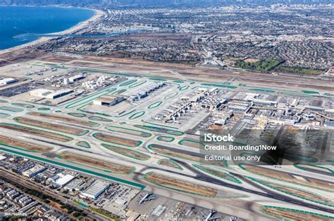exterior of los angeles international airport with aircrafts on tarmac