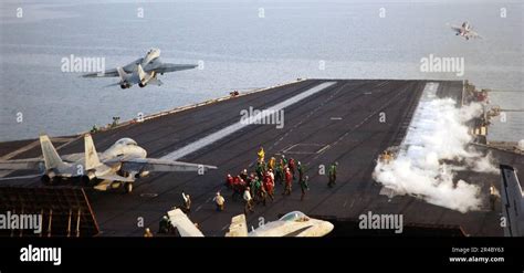 F-14D Tomcat VF-213 Black Lions parked on aircraft carrier flight deck