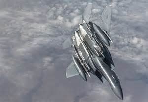 f-15 eagle high-altitude flight in clear sky