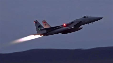 F-15 Eagle with afterburners engaged in high-speed climb