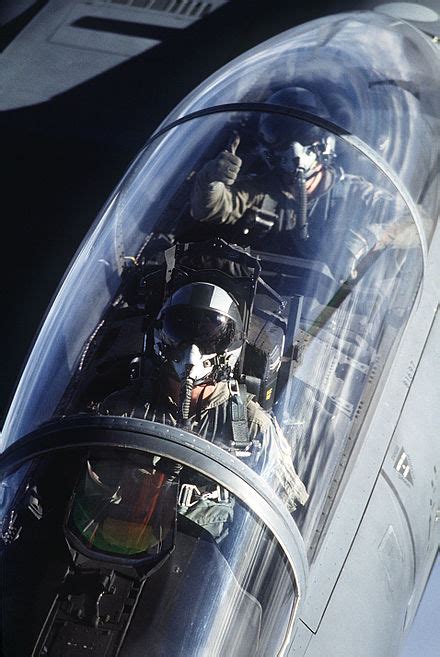 F-15E cockpit showing pilot and weapon systems officer operating advanced displays