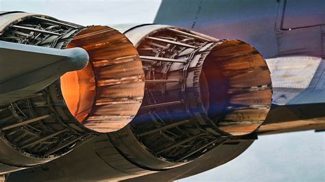 F-15E engines producing afterburner flames during a high-speed canyon exit maneuver