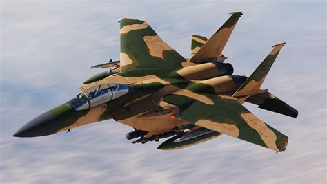 f-15sa in desert camouflage scheme flying over dunes