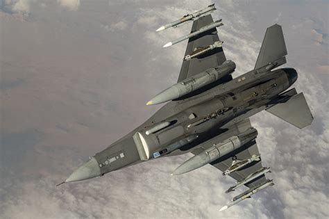 f-16 carrying external fuel tanks and missiles