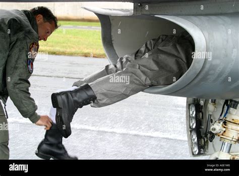 F-16 pilot inspecting jet post-landing on Myrtle Beach tarmac