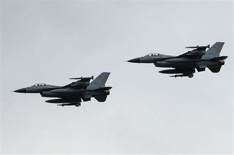 F-16 Wild Weasel flying low altitude over hostile territory