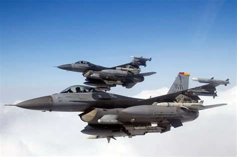 F-16 Wild Weasel pilots in briefing room before a SEAD mission in 2023