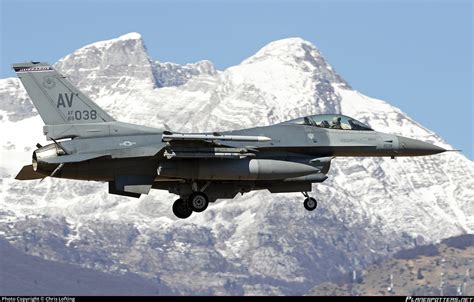 F-16C Fighting Falcon in flight with afterburner over mountainous terrain