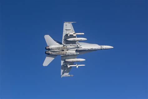F-18D with advanced electro-optical sensor pod under night conditions