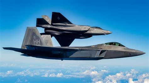 F-22 and F-35A flying in formation over CENTCOM airspace during joint patrol mission