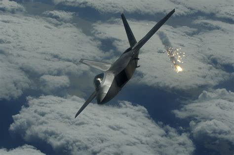 F-22 engaging in mock dogfight against a fourth-generation fighter