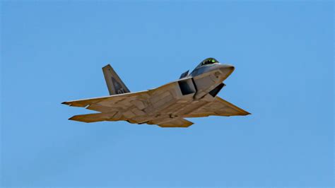 f-22 flying over restricted airspace avoiding enemy radar