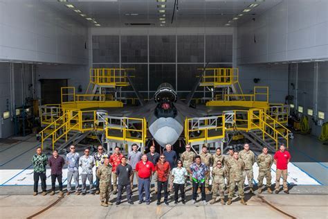 F-22 maintenance crew inspecting stealth coatings
