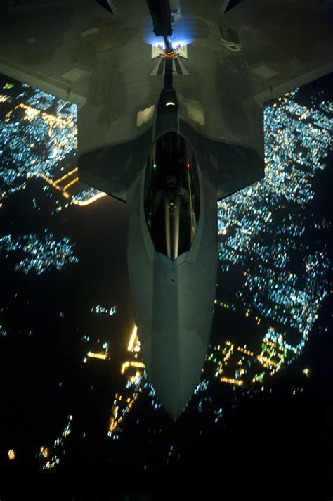 F-22 performing aerial refueling mid-mission