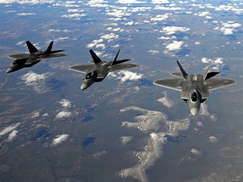 F-22 Raptor exchanging tactical data with allied fighter aircraft during joint exercise