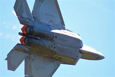 F-22 Raptor in full afterburner during high-G maneuver in red flag exercise