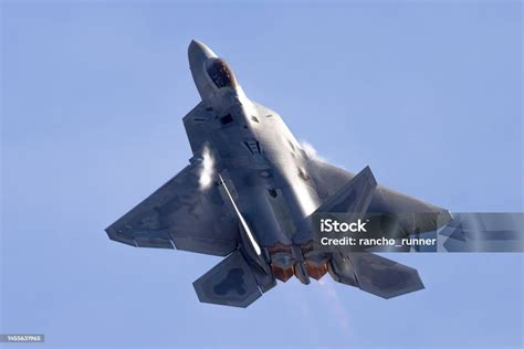 F-22 Raptor performing high-G maneuver during air superiority exercise