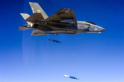 f-22 raptor performing precision bomb drop test with gbu-32 jdam