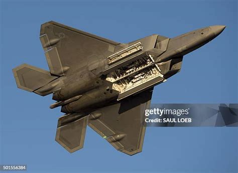 F-22 Raptor stealth fighter in flight high angle maneuver