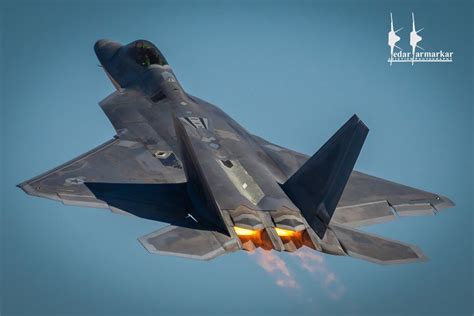 F-22 Raptor taking off with afterburners during night operations