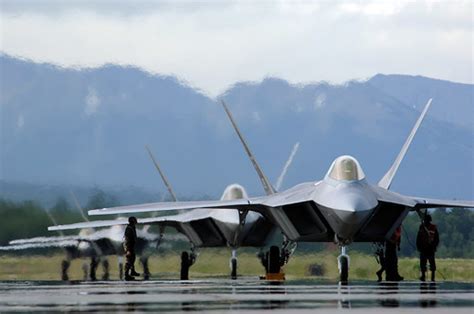 F-22 Raptors lined up on Atlantic coastal airbase runway