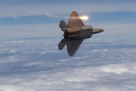 F-22 releasing flares during combat maneuvers