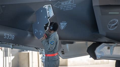 F-22 undergoing maintenance, showcasing removable mirror tiles