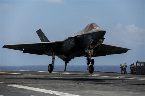 F-35 Lightning II landing on aircraft carrier amid Indo-Pacific training operations