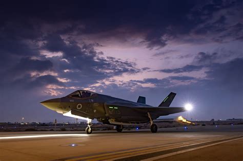 F-35 pilot’s visor display showing sensor-fused targeting data in night combat