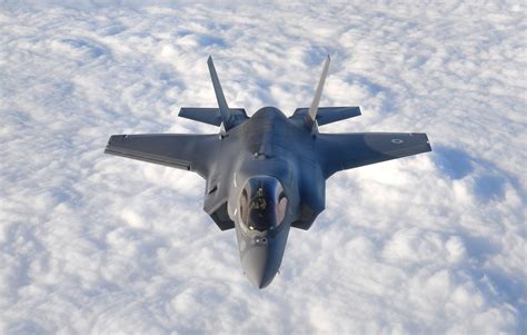 f-35 stealth fighter over pacific ocean in formation flight