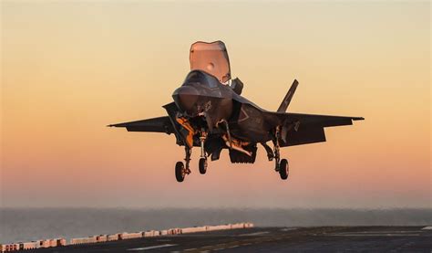 F-35 targeting ground installation using EOTS laser designation during night exercise
