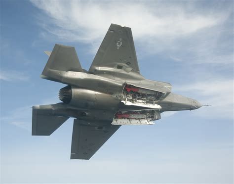 F-35B hovering with inboard weapons bay doors open capturing fountain flow