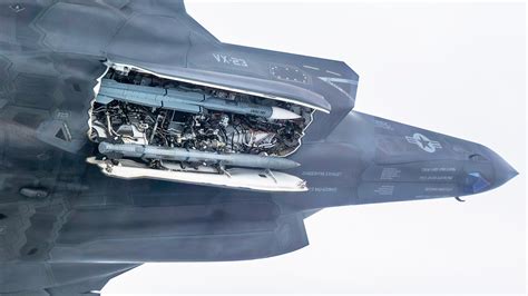 F-35B under deck maintenance aboard USS America, with constrained crew access, 2023