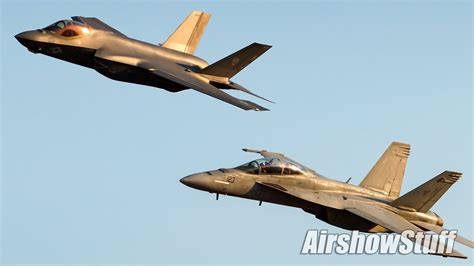F-35C and F-A-18 Super Hornet flying formation carrier air wing integration