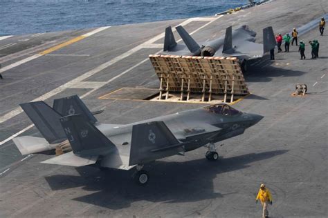 F-35C Lightning II and F-A-18 Super Hornet on aircraft carrier flight deck