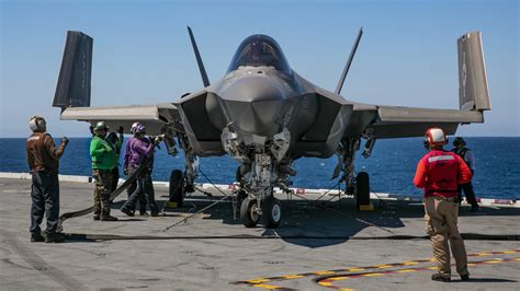 F-35C on USS Carl Vinson deck showing folding wings and extended fuel capability