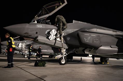 F-35I ground crew performing post-sortie maintenance operations at night near Gaza border