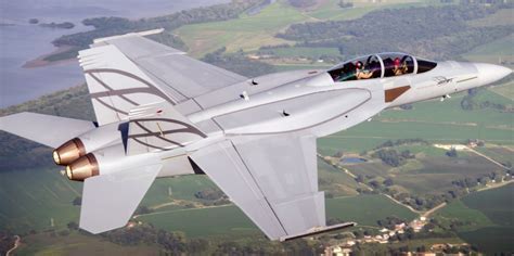 F/A-18 Block III Super Hornet showcasing conformal fuel tanks on its fuselage