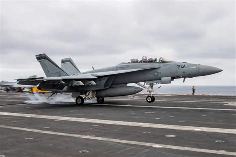 F/A-18 landing on an aircraft carrier deck