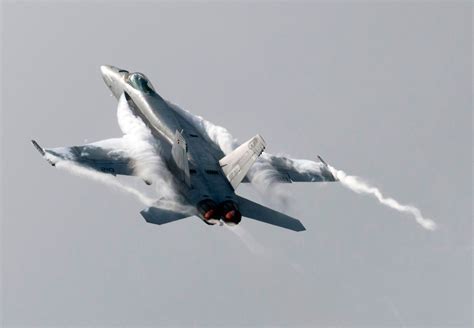 F/A-18 performing a high angle-of-attack maneuver, demonstrating vortex formation