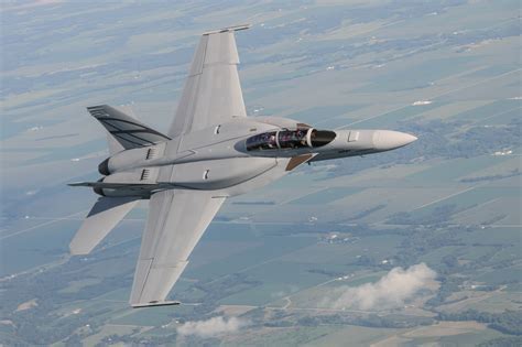 F/A-18 Silent Hornet with enclosed weapons pod and conformal fuel tanks in flight