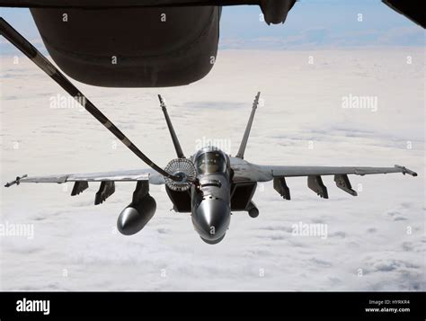 F/A-18 Super Hornet conducting aerial refueling over ocean